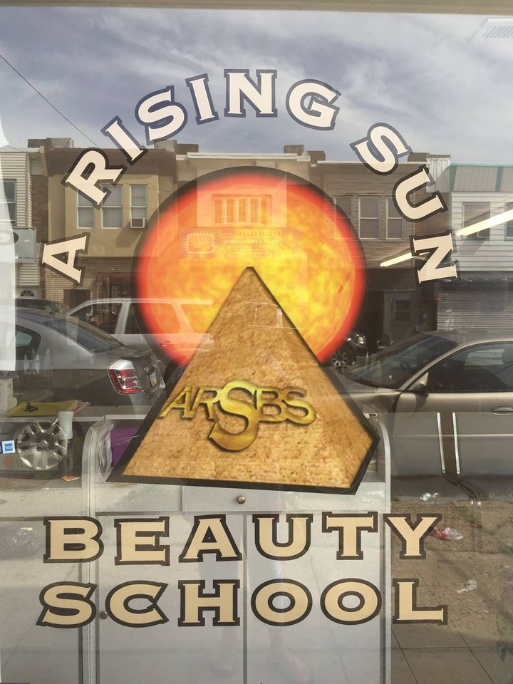 A Rising Sun Beauty School Logo